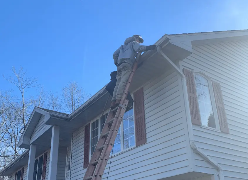 Gutter cleaning and maintenance being performed by Tallmadge Power Washing in Tallmadge